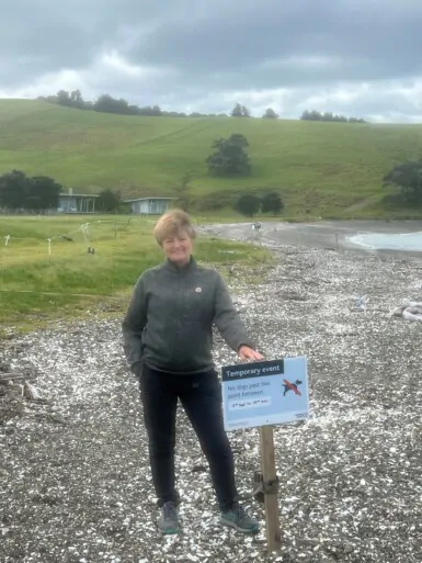 Our Commitment to the Environment 2 Gabrielle in front of area being protected to assist dotterel nesting at Church Bay