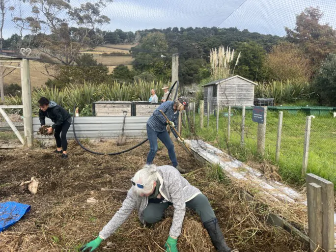 Our Commitment to the Environment 4 Justine, Dell, and Maria working in the Marae garden